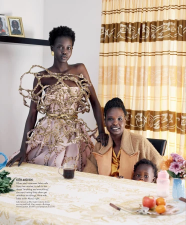 Editorial portrait of a Black female model standing behind a seated woman and child styled by Christine Centenera in Sydney.
