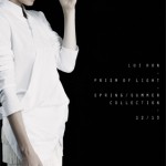 Fashion shoot of a woman in a white jacket and skirt against a dark background. Text visible: LOT NEW - PRIZM OF LIGHT - SPRING/SUMMER COLLECTION.