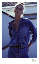 Woman wearing a blue denim jacket outdoors with backlit hair, styled by Jessica Diez in Sydney.