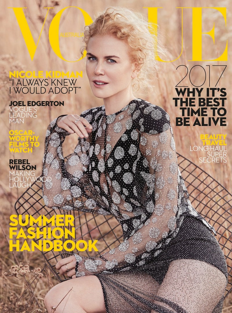 Magazine cover featuring Nicole Kidman in a sheer black dress, seated in a field. Vogue masthead and text overlays.