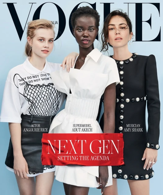 Vogue Australia cover featuring three women: actor Angourie Rice, supermodel Adut Akech, and musician Amy Shark, in a studio setting.