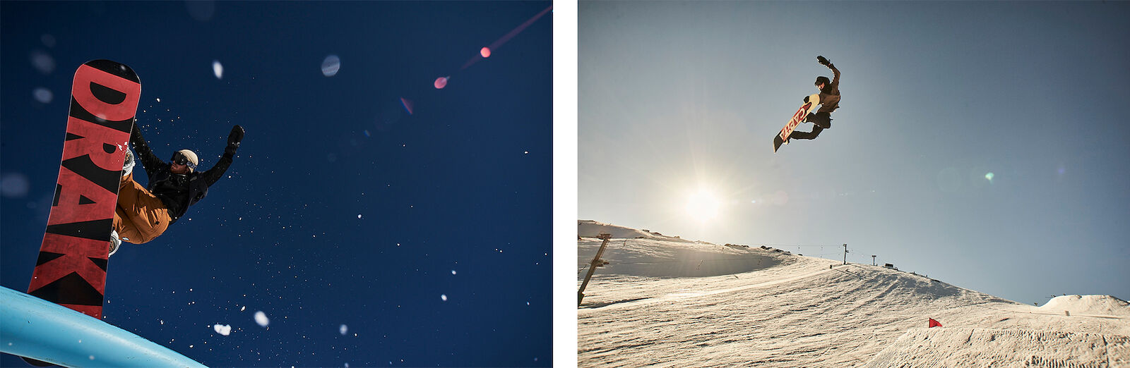 Action shot of a snowboarder performing a trick in the air against a blue sky and a snowy mountain background during daytime.