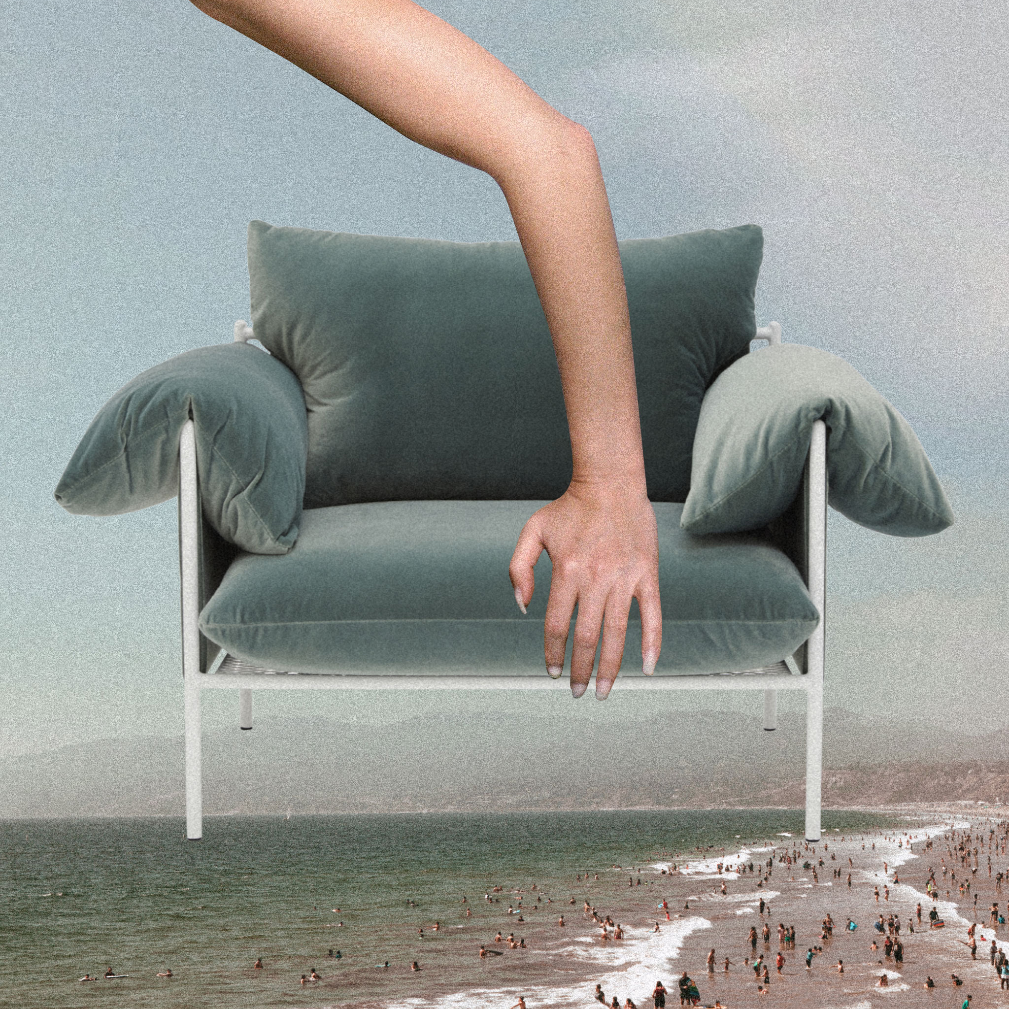 Modern teal-colored chair with a white frame is juxtaposed against an outdoor beach and ocean scene with many people enjoying the day.