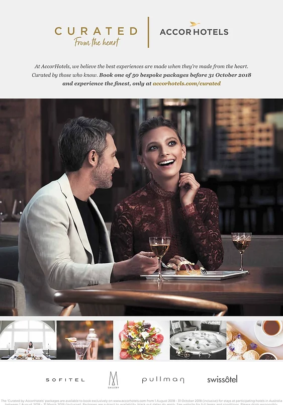 Sophisticated couple enjoys curated dining experience at Accor Hotels. The woman smiles, showcasing elegant attire at a table set for an intimate meal.