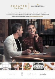 Man and smiling woman seated at a restaurant table with drinks and dessert, produced by Laura Midalia in Sydney