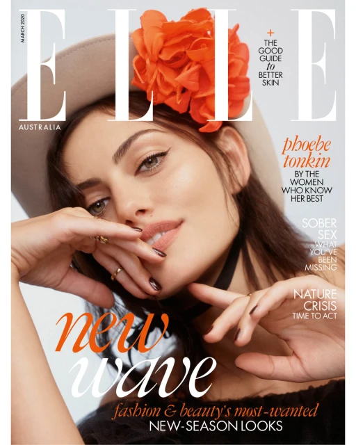 Elle Australia magazine cover featuring Phoebe Tonkin, March 2020, close-up shot, wearing a hat with orange floral decoration, beauty and fashion.