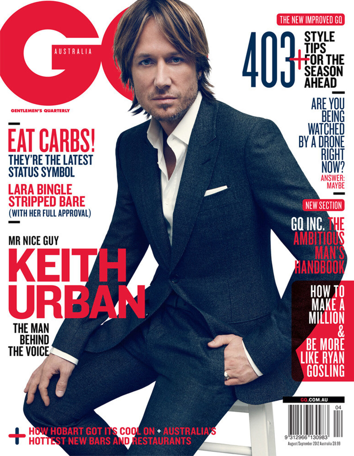 Keith Urban on GQ Australia cover, wearing a grey suit, seated on stool. Magazine features headlines about style tips, Lara Bingle, and drones.