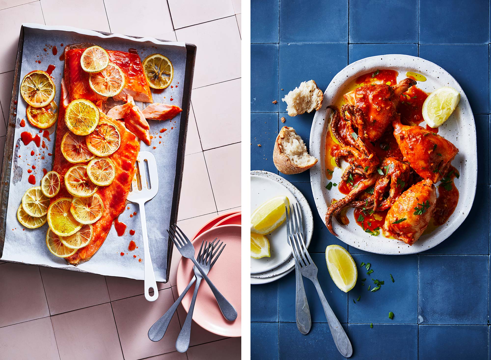 Overhead shot of salmon with lemon slices on a baking sheet next to octopus in red sauce, complemented by plates and forks.