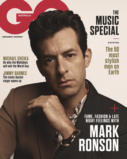 Magazine cover featuring Mark Ronson. He is wearing a suit jacket with a patterned shirt, close-up studio portrait, celebrity fashion.