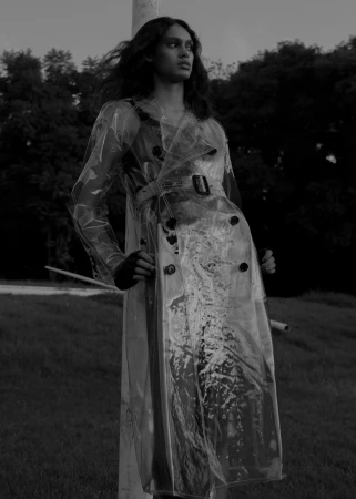 Model wearing a translucent vinyl trench coat outdoors styled by Anastacia Bijou in Sydney