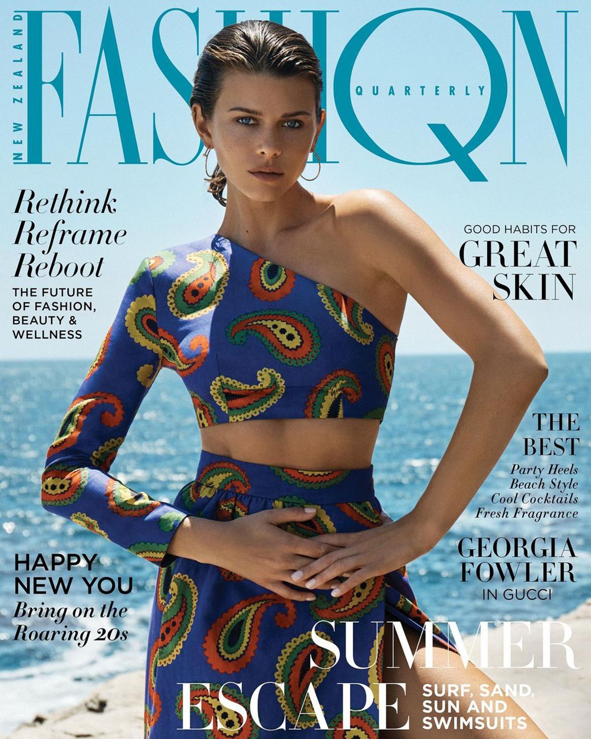 Fashion magazine cover featuring a woman in a patterned crop top and skirt, ocean background, text overlay.
