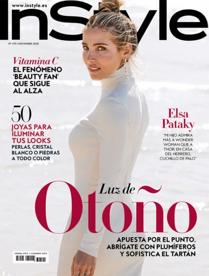 InStyle cover featuring a blonde woman in a white dress, posing in an outdoor setting, with magazine text overlay and sandy tones.