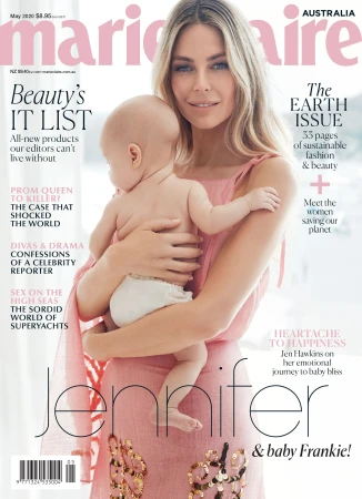 Jen Hawkins holding a baby in a pink dress for a magazine cover with pink typography overlay