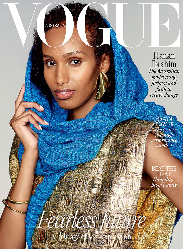 Vogue Australia cover featuring Hanan Ibrahim, an Australian model, in a blue scarf and gold textured dress against a neutral backdrop.