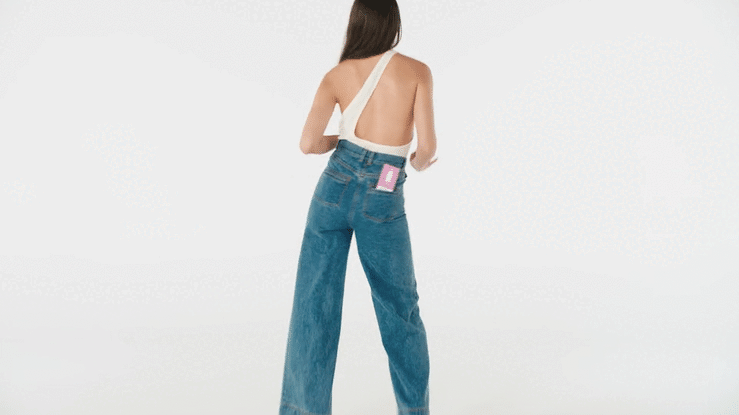 An empty white photo studio backdrop, with a soft graduated gradient, suitable for product photography or portraiture, in a bright setting.