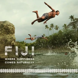 Two boys diving mid-air into a river with palm trees and a rocky outcrop in the background, produced by Matt Chee.