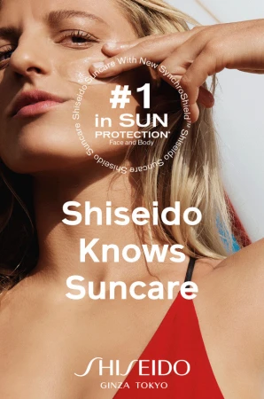 Advertisement for Shiseido Suncare featuring an adult woman with her hand on her face, promoting sun protection for face and body.