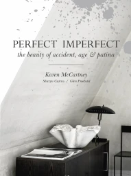 Book cover for Perfect Imperfect featuring a white decorative ceramic bowl and dark lamp on a wooden cabinet.