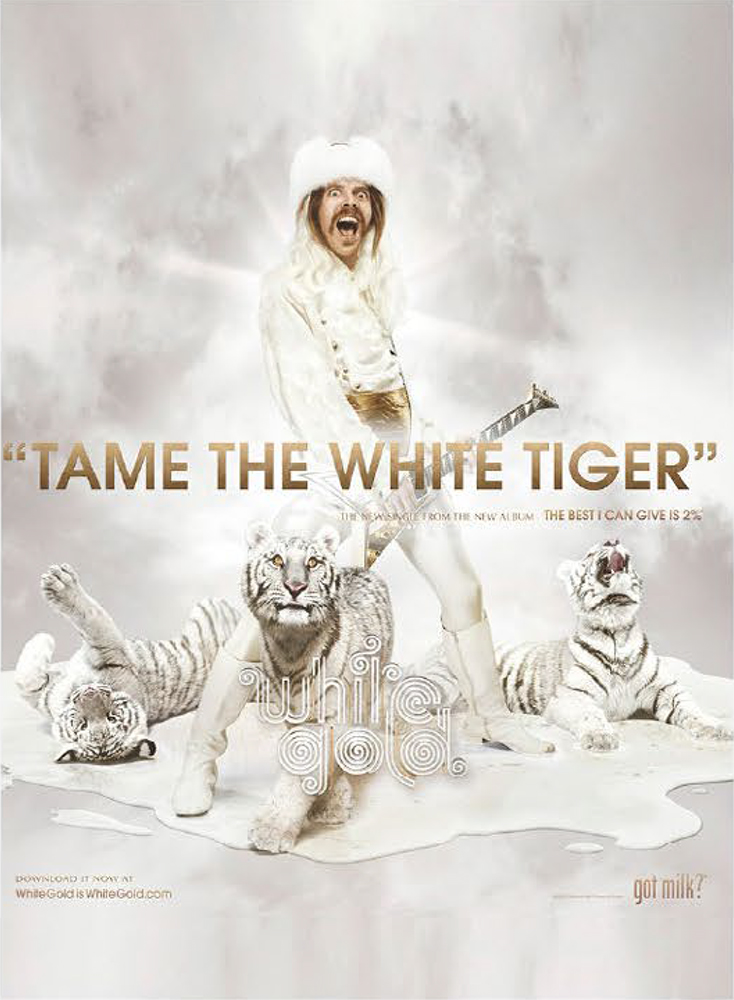 Promotional image featuring a man in a white suit and fur hat holding a guitar, surrounded by white tigers against a cloudy backdrop.