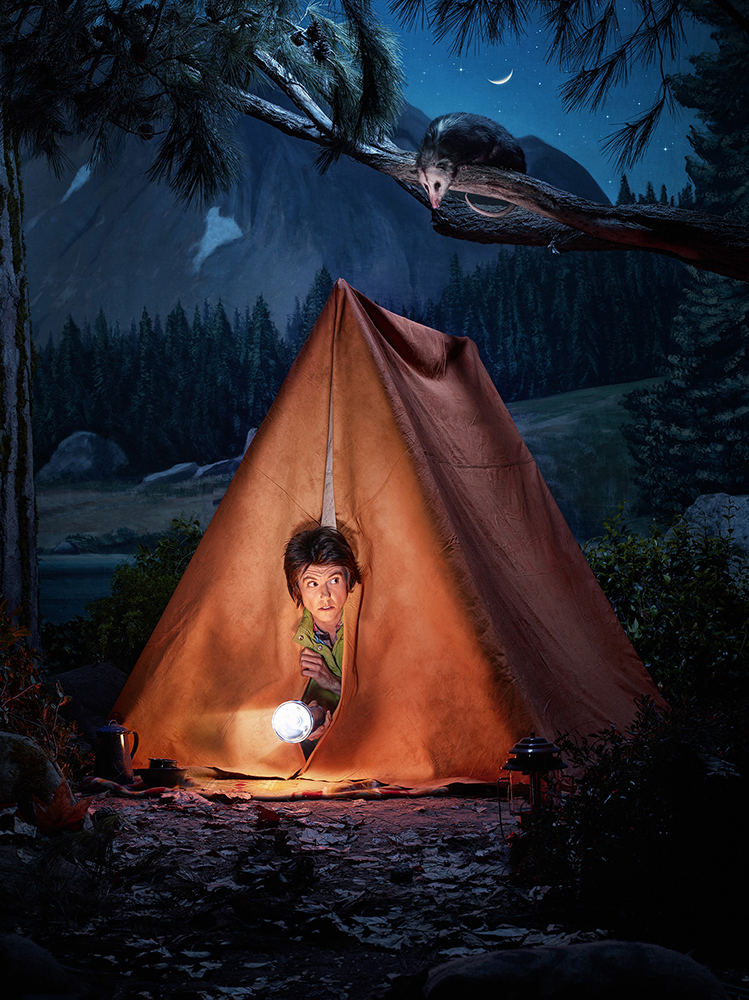 Young child peers out of tent at night in a forest as a opossum sits on a tree branch under a crescent moon.