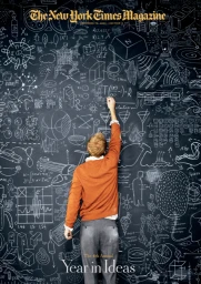 A man standing facing a large dark chalkboard covered in white chalk drawings and mathematical equations, photographed from behind.