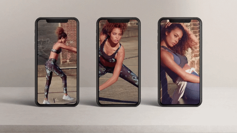 Three smartphones display images of a woman in athletic wear in front of a brick wall, showcasing workout routines and posing.