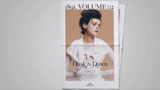 Newspaper print featuring an editorial fashion portrait of a woman wearing a white wrap top with text overlays.