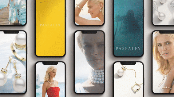 Paspaley jewelry ads displayed on smartphones. The ads showcase pearls and women in various glamorous settings, including underwater.