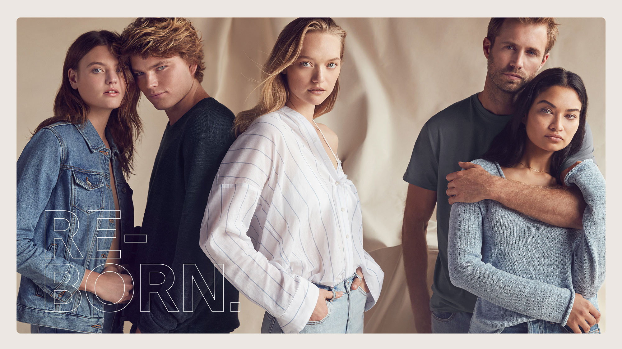 Group of five models in casual apparel posing against a draped neutral studio backdrop with overlaid text