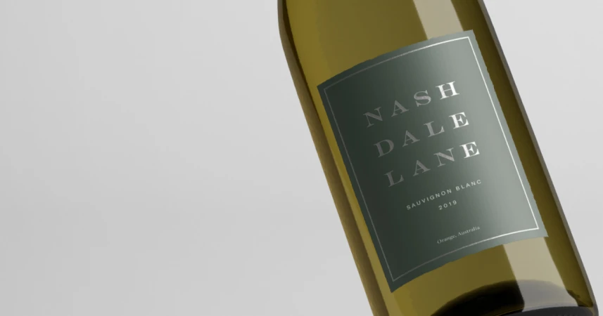 A single bottle of Nashdale Lane Sauvignon Blanc wine sits against a neutral background, highlighting the bottle's elegant label.