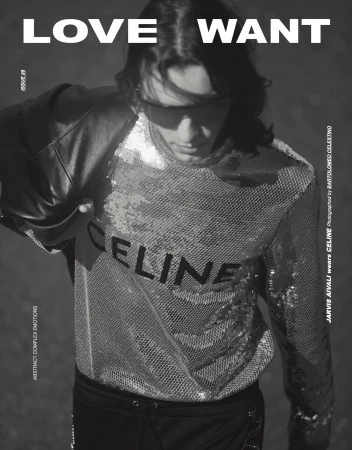 Monochrome fashion shot of a young adult wearing a shiny shirt with CELINE on it, against a neutral gradient background in a studio.