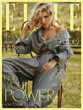 Elsa Pataky wearing a grey jumpsuit seated on a metal chair outdoors for an Elle magazine cover with make-up by Sarah Tammer