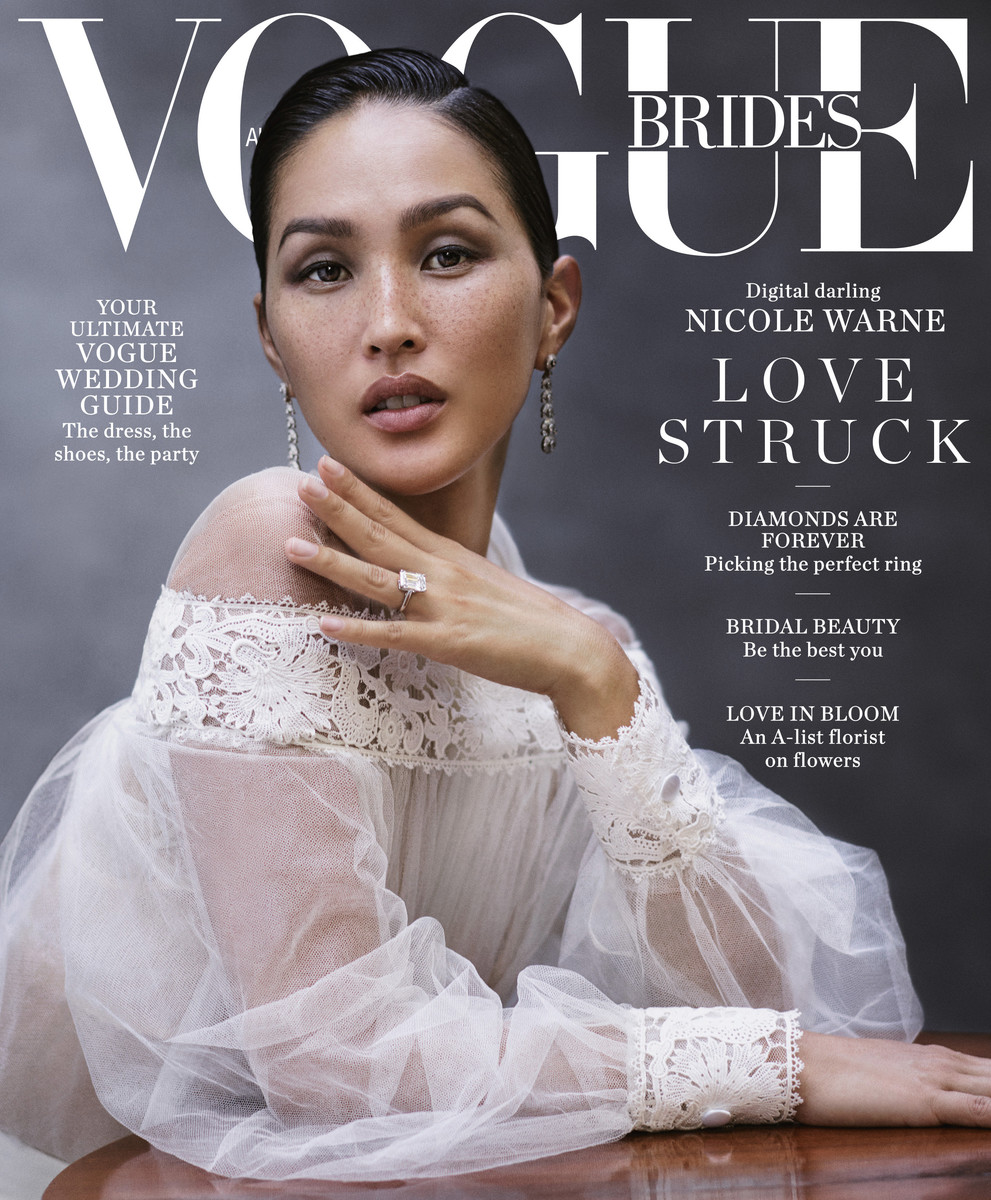 Vogue Brides cover featuring Nicole Warne in a white lace dress and diamond ring, highlighting bridal fashion and beauty.