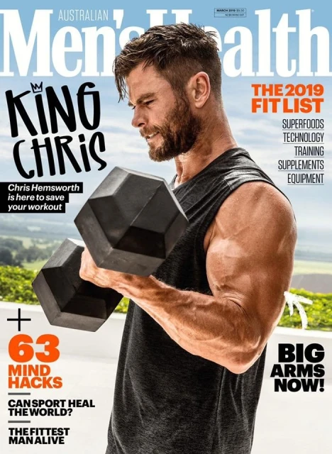Australian Men's Health magazine cover featuring Chris Hemsworth lifting a dumbbell, showcasing fitness and health themes.