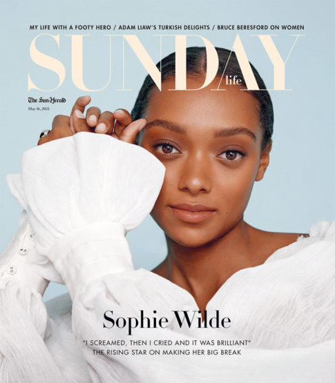 Close-up magazine cover featuring Sophie Wilde, with her face and shoulders, wearing a white blouse, set against a light blue background.