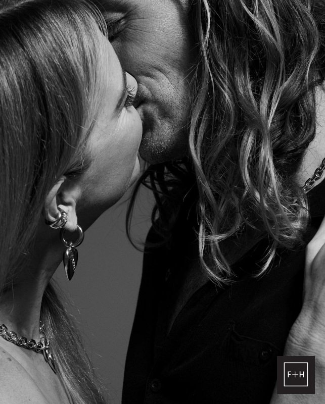 Close-up monochrome portrait of a couple kissing, photographed by Wade Edwards in Sydney.