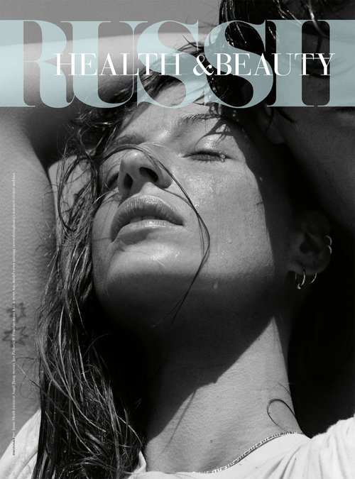 Magazine cover featuring a woman with wet hair, closed eyes, and a serene expression, bathed in natural light, with 'RUSH HEALTH & BEAUTY' text overlay.