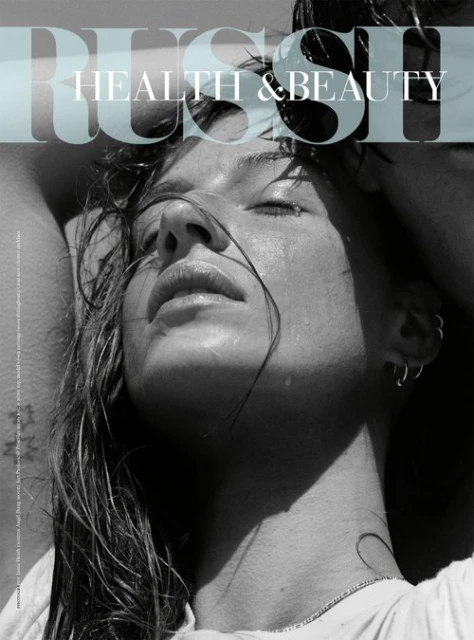 Magazine cover featuring a woman with wet hair, closed eyes, and a serene expression, bathed in natural light, with 'RUSH HEALTH & BEAUTY' text overlay.