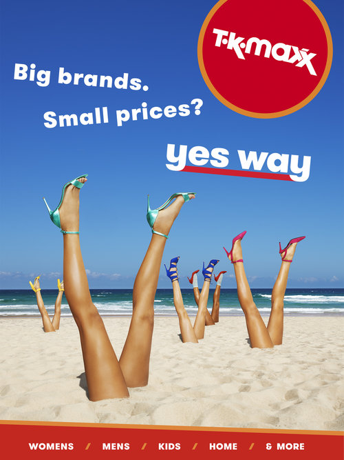 TK-maxx ad featuring legs sticking out of sand, wearing colorful high heels, on a beach with a blue sky and 'yes way' text overlay.