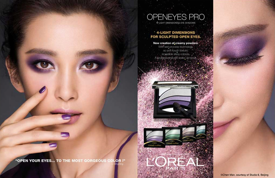 Cosmetic advertisement featuring a woman with purple eyeshadow and nail polish, alongside L'Oreal Paris makeup product packaging.