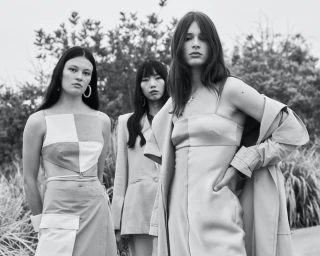 Three female models posing outdoors in monochrome fashion photography styled by Joey Scandizzo in Sydney.