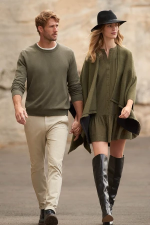 Man and woman holding hands walking outdoors, styled by Chloe Buttenshaw in Sydney
