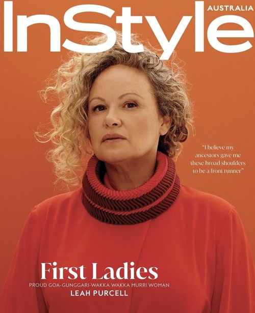 InStyle Australia magazine cover featuring Leah Purcell, an adult female with curly blonde hair, wearing a red top against an orange backdrop.