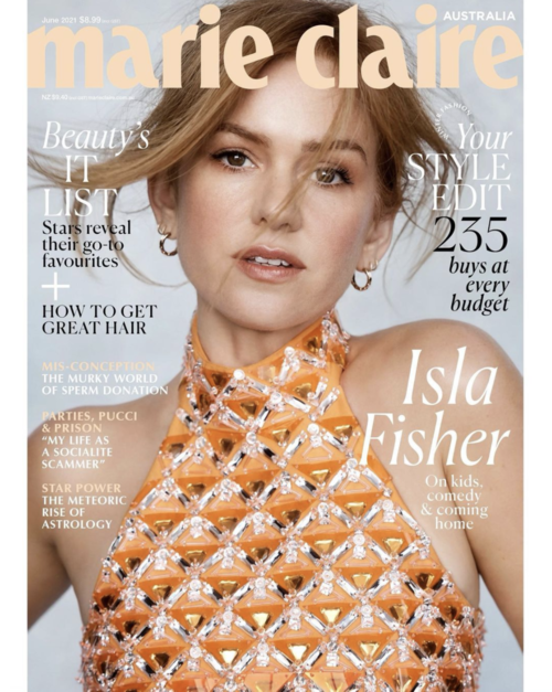 Marie Claire Australia cover featuring Isla Fisher in an orange embellished dress, magazine layout with text, and close-up portrait.