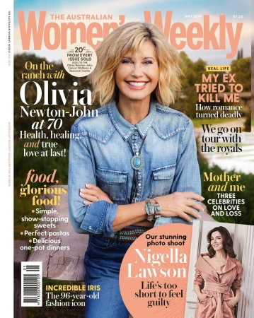 Olivia Newton-John smiles on the cover of The Australian Women's Weekly, wearing a denim shirt and turquoise jewelry, promoting a story on her life.