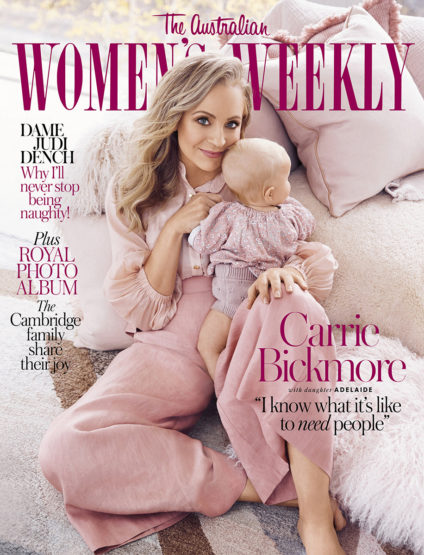 Magazine cover featuring Carrie Bickmore and her daughter Adelaide, both in pink outfits, on a neutral-toned, pillow-filled background.
