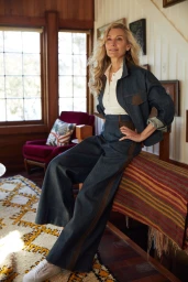 Mature woman with blonde wavy hair wearing a denim jacket and pants styled by Mattie Cronan in Sydney.