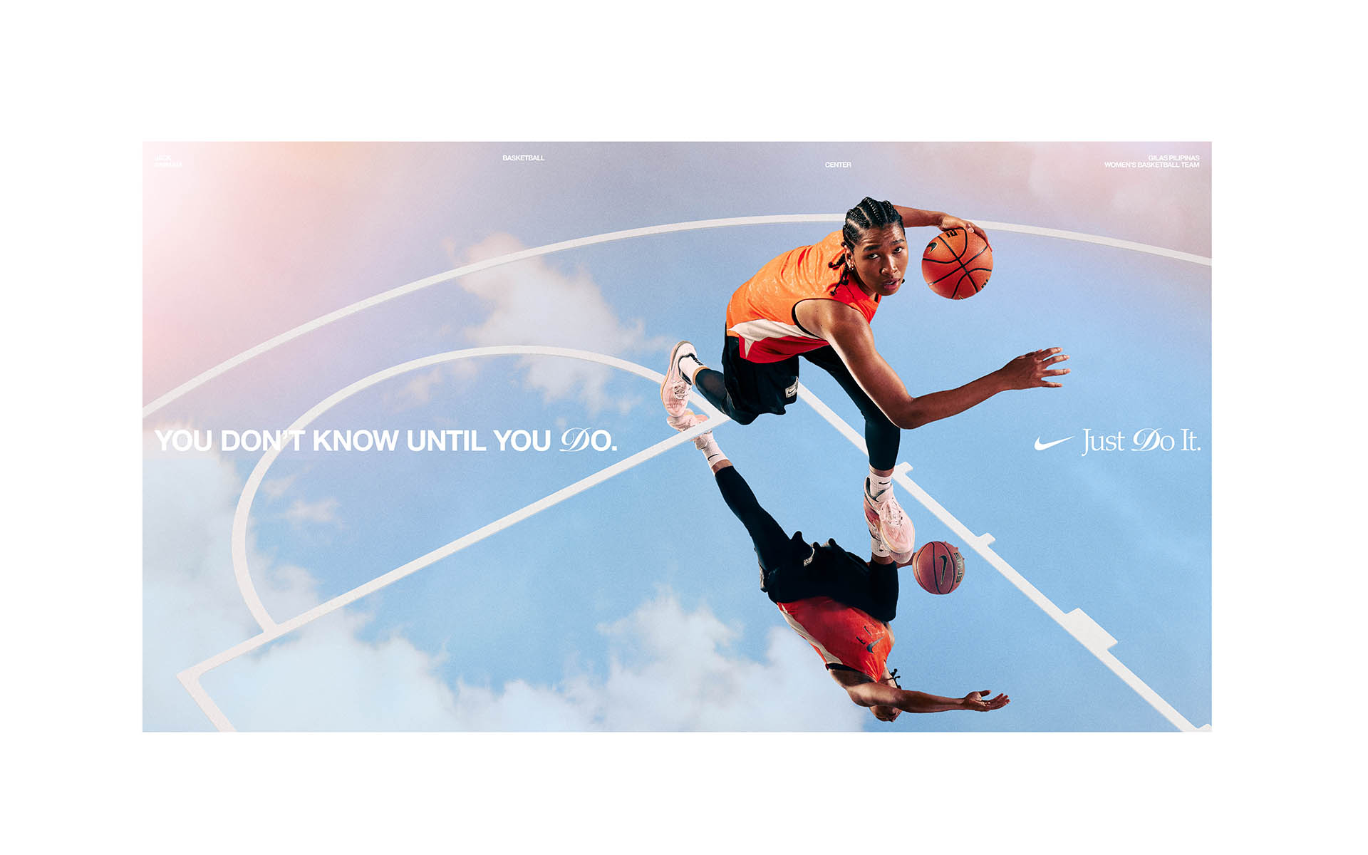 A basketball player dribbles in front of a blue sky and court outline in a Nike advertisement promoting the phrase 'Just Do It'.
