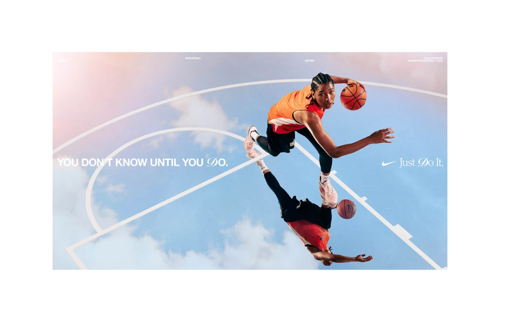 A basketball player dribbles in front of a blue sky and court outline in a Nike advertisement promoting the phrase 'Just Do It'.