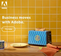 Still life featuring a blue toaster with bread, plate, mug, and towel against a yellow tiled wall in a kitchen setting.